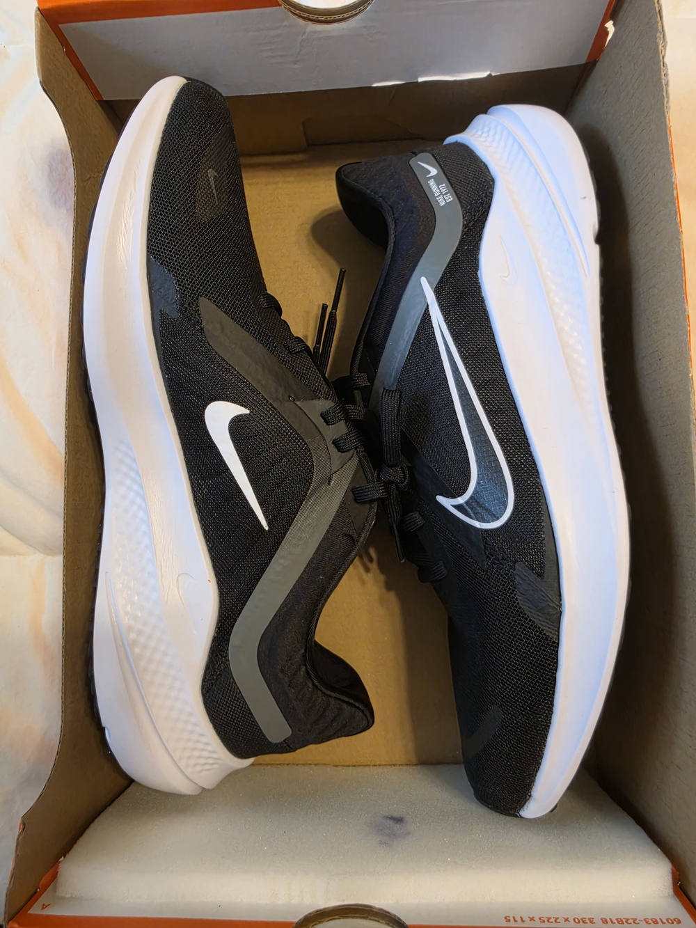 Nike Men’s Black Running Shoes with White Swoosh